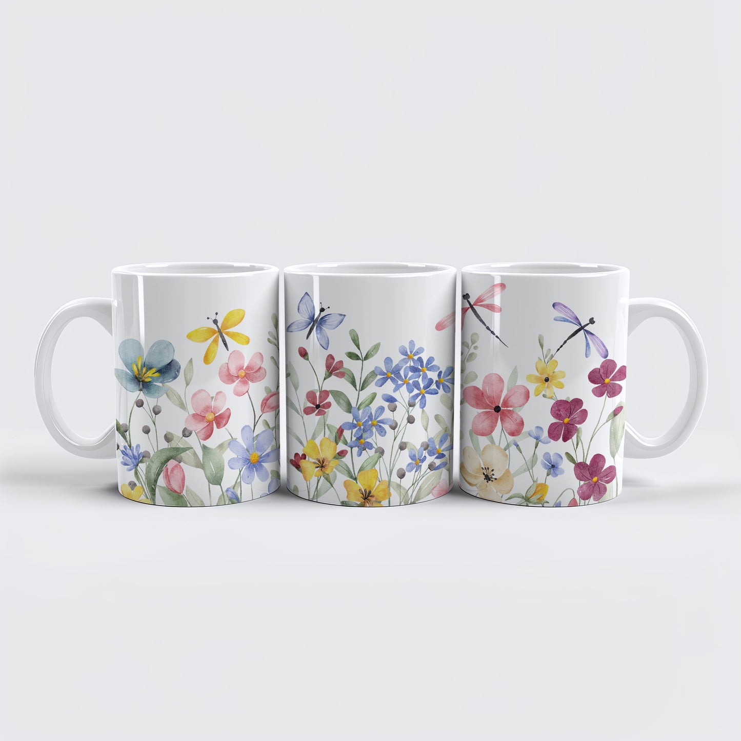 Ceramic cup with colorful wildflowers and butterflies, perfect for nature lovers.
