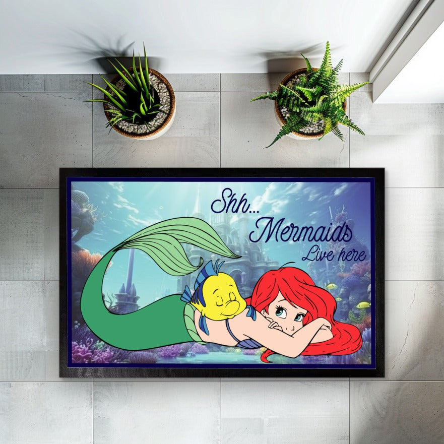 Enchant your entryway with this magical Mermaids Welcome mat.