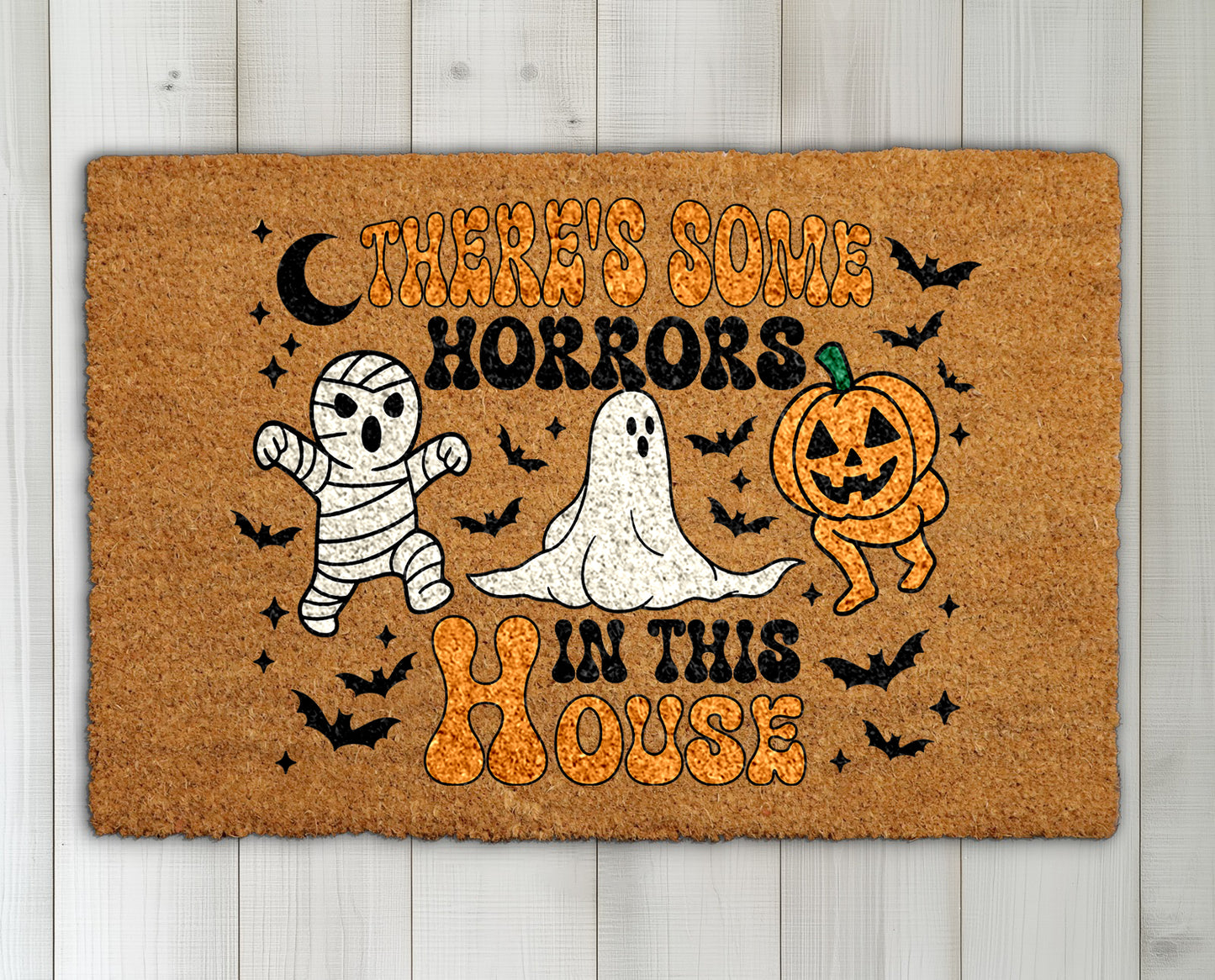Spooky Halloween doormat featuring mummy, ghost, pumpkin design for fall.