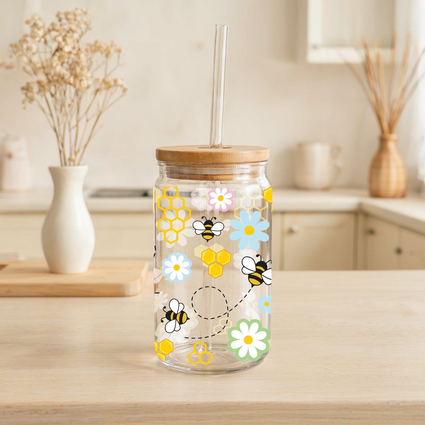 Bee-themed glass tumblers for stylish sips.