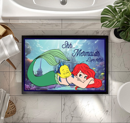 Enchant your entryway with this magical Mermaids Welcome mat.